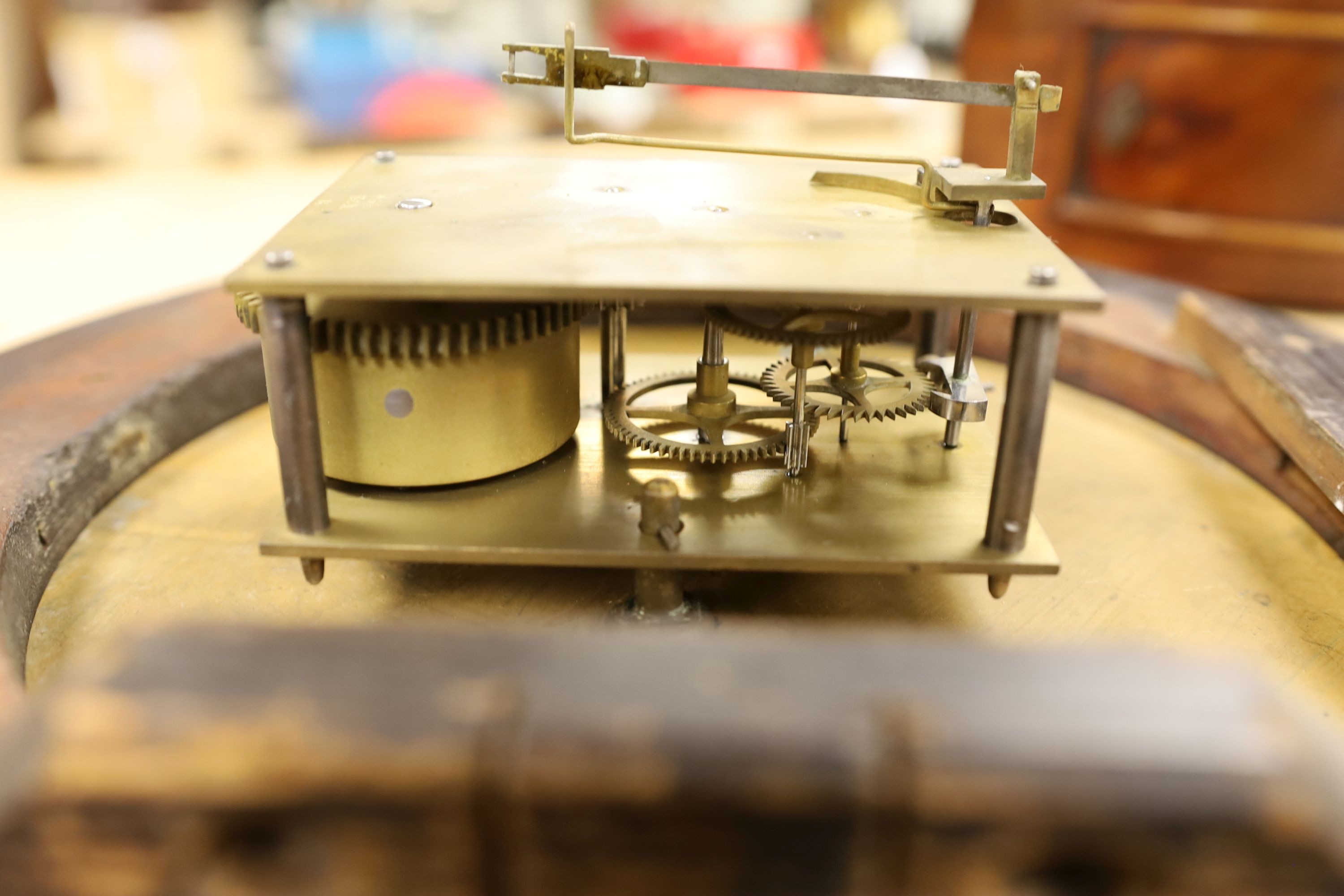 A Camera Kuss & Co. mahogany dial clock, 30 cms diameter.
